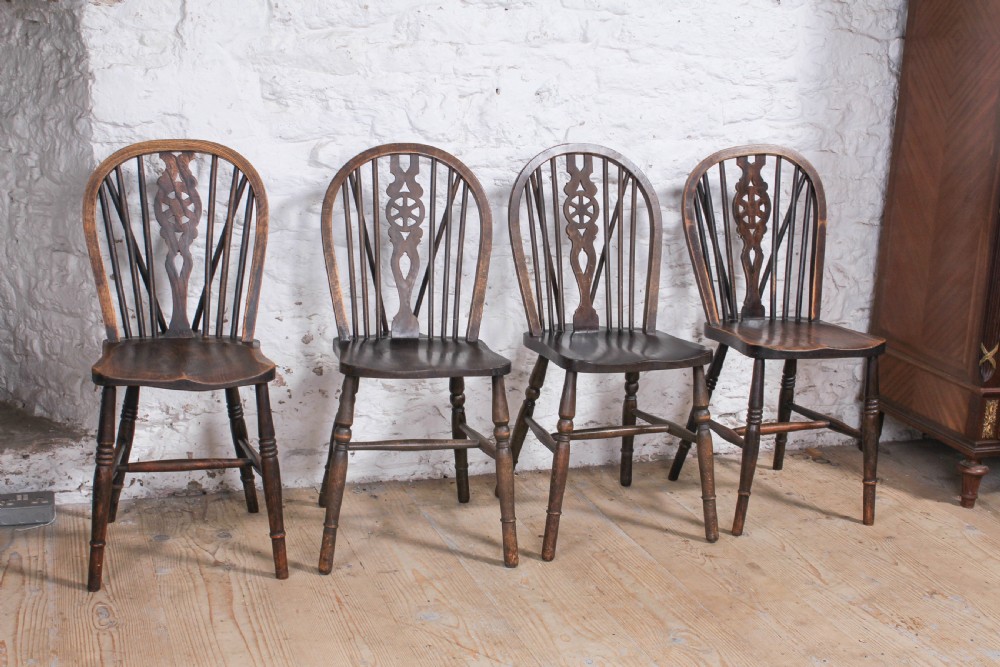 6 Windsor Wheel back chairs with carver  View II