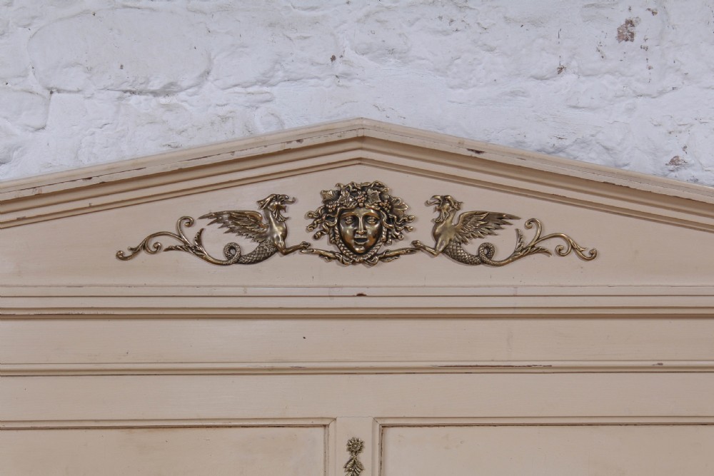 An off-white painted French king-size bedstead featuring gilt metal mounts, torch motifs, and carved claw feet. View III