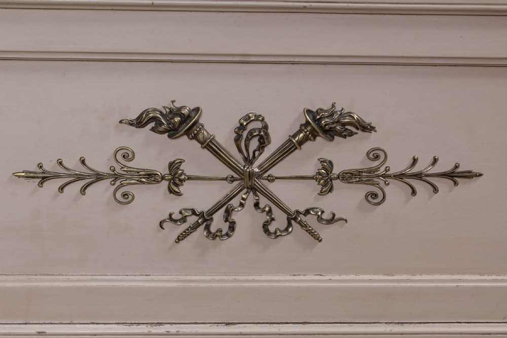 An off-white painted French king-size bedstead featuring gilt metal mounts, torch motifs, and carved claw feet. View VIII