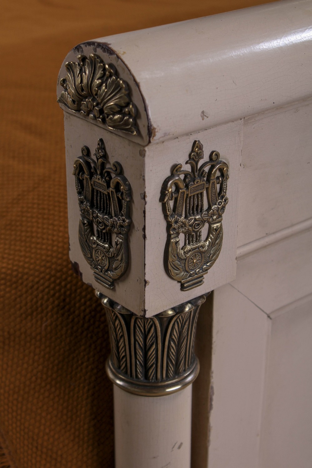 An off-white painted French king-size bedstead featuring gilt metal mounts, torch motifs, and carved claw feet. View IX