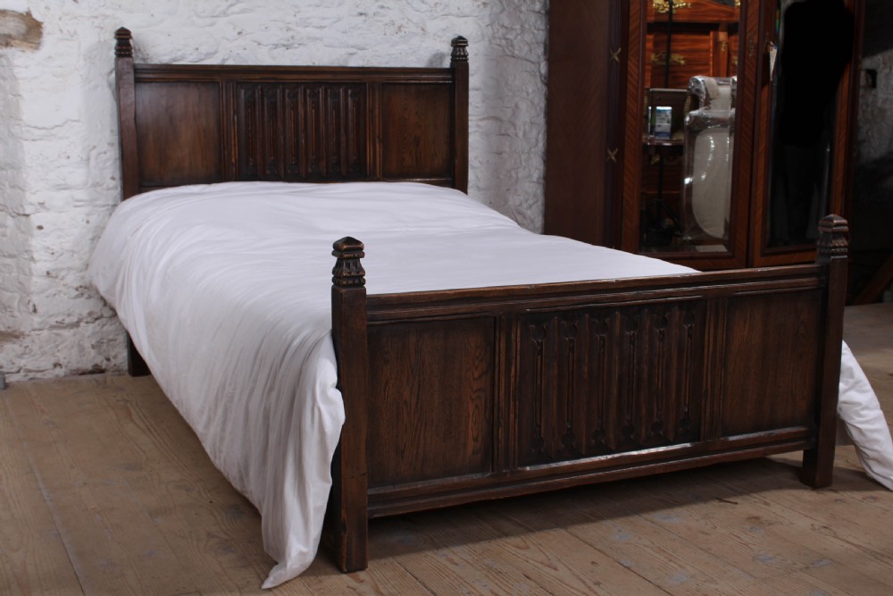 Lovely  oak double bed with linen fold detail 