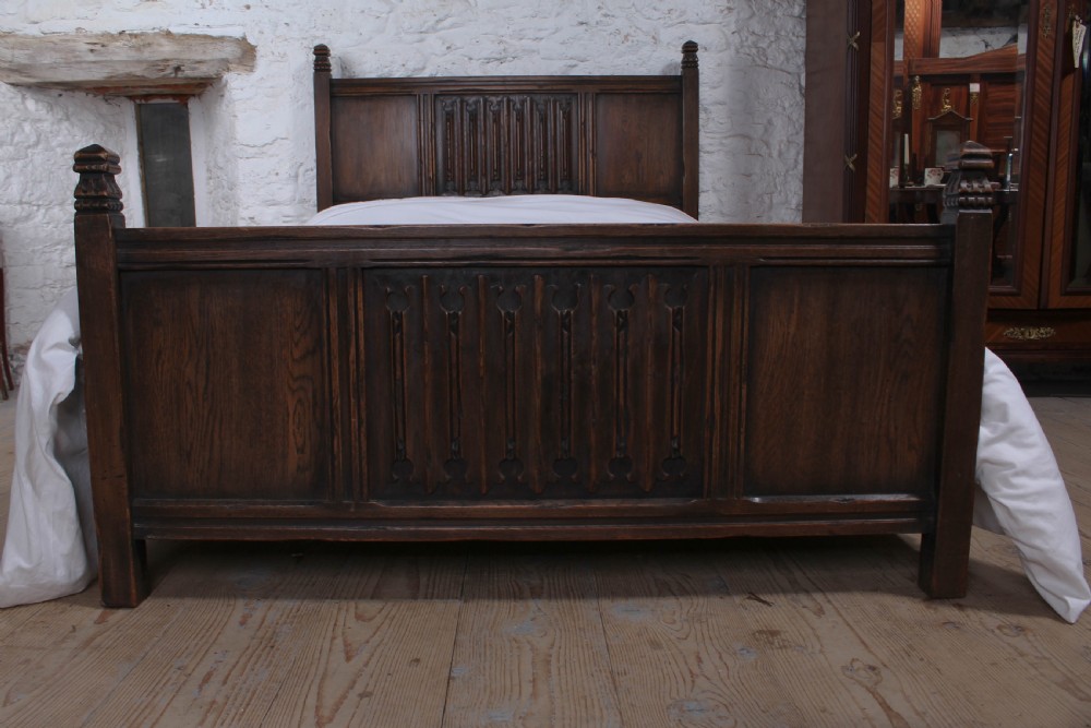 Lovely  oak double bed with linen fold detail  View III