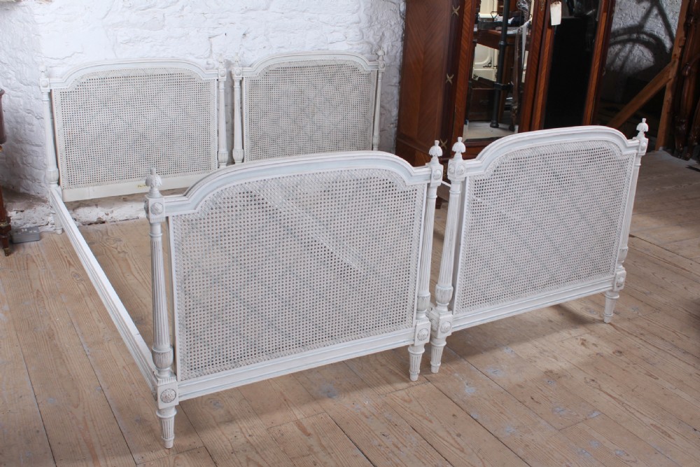 Pretty pair of French painted caned single beds View VI