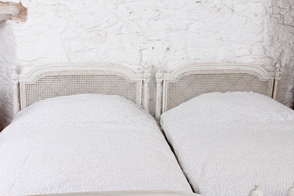 Pretty pair of French painted caned single beds View VII