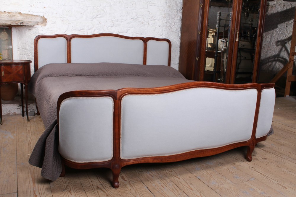 Sophisticated newly upholstered French corbeille style super kings size bed