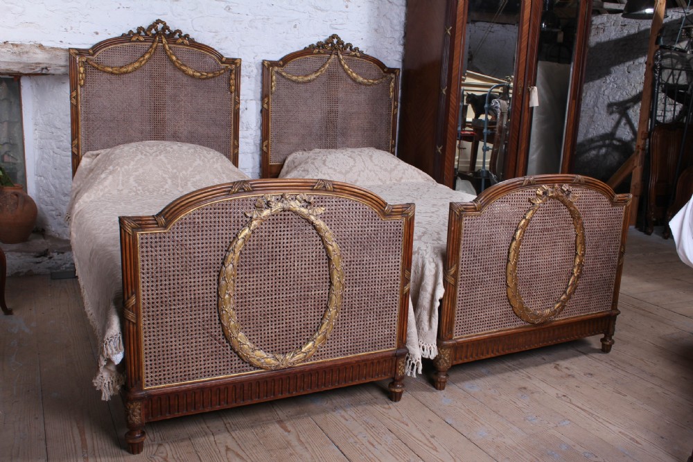 Spectacular pair of caned Empire style bergere meter wide beds (can be joined)