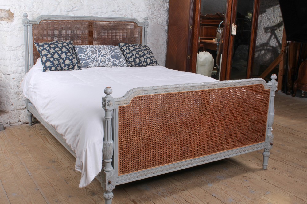 Attractive carved caned king size bed 