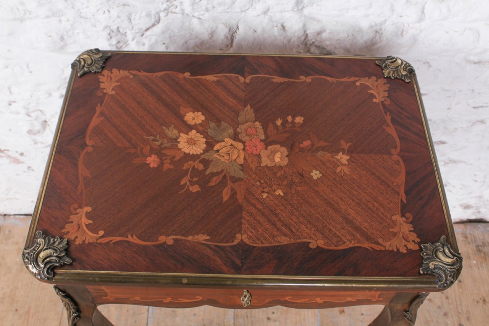 A French Louis XV style walnut side table featuring floral marquetry inlay, cabriole legs, and brass ormolu mounts. View III