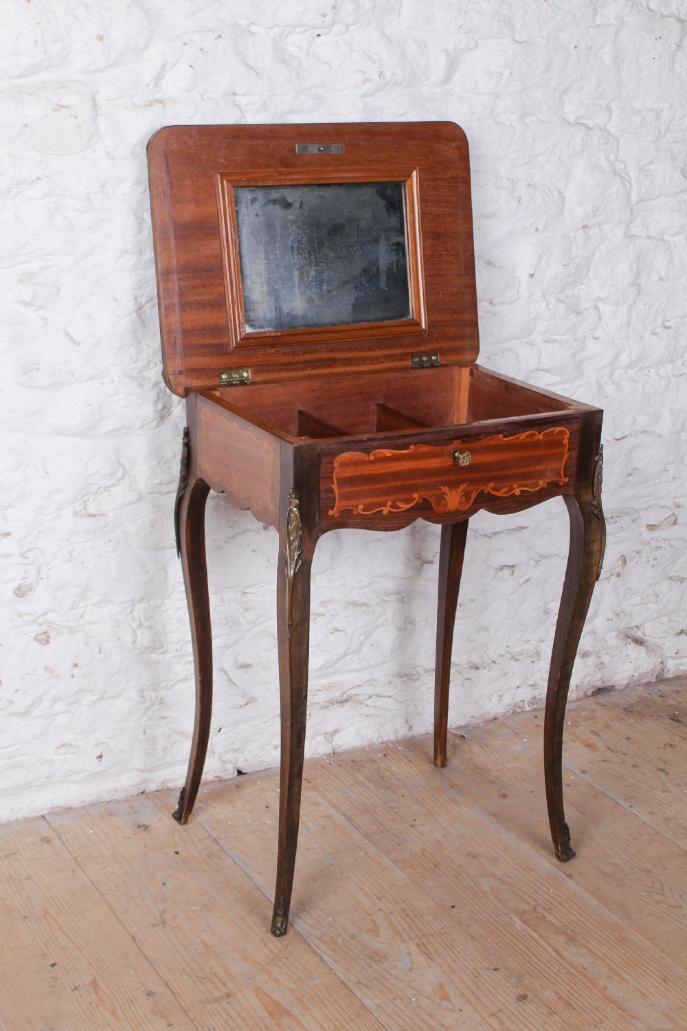 A French Louis XV style walnut side table featuring floral marquetry inlay, cabriole legs, and brass ormolu mounts. View V