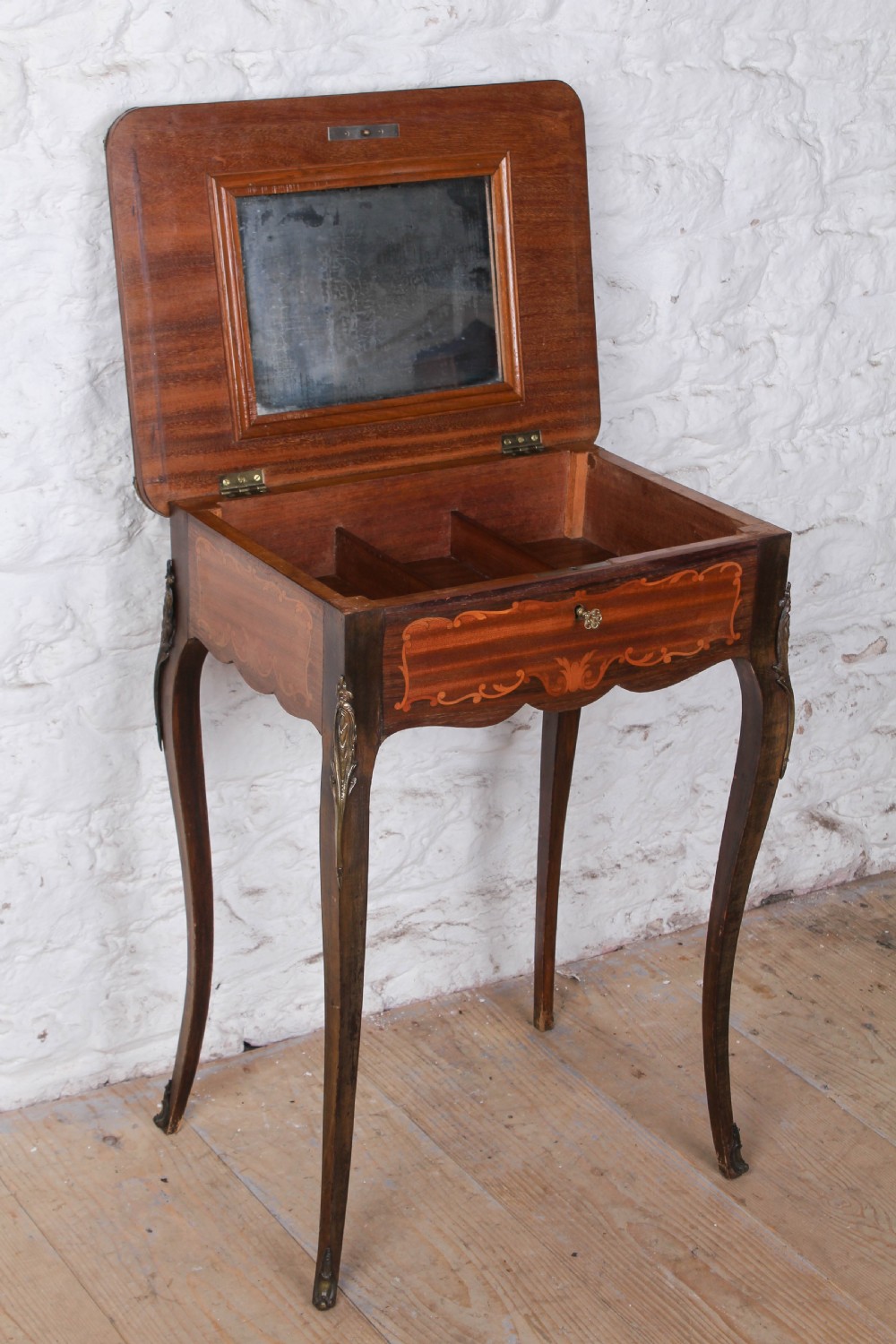 A French Louis XV style walnut side table featuring floral marquetry inlay, cabriole legs, and brass ormolu mounts. View VII