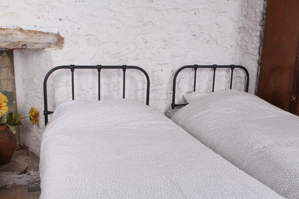 Lovely simple pair of Staples  utilitarian single iron beds (can be joined) View III