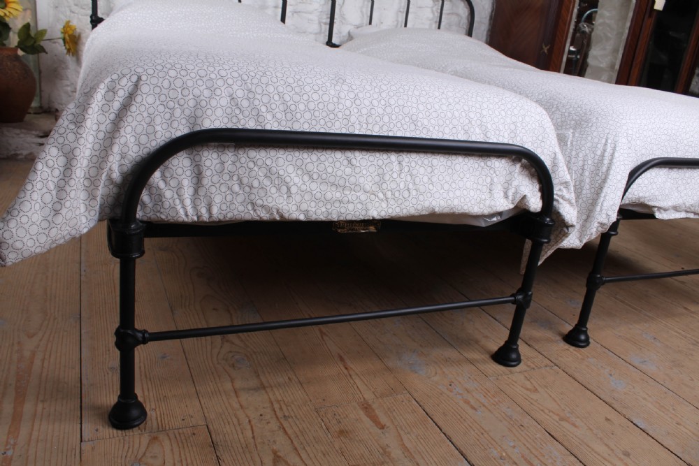 Lovely simple pair of Staples  utilitarian single iron beds (can be joined) View IV