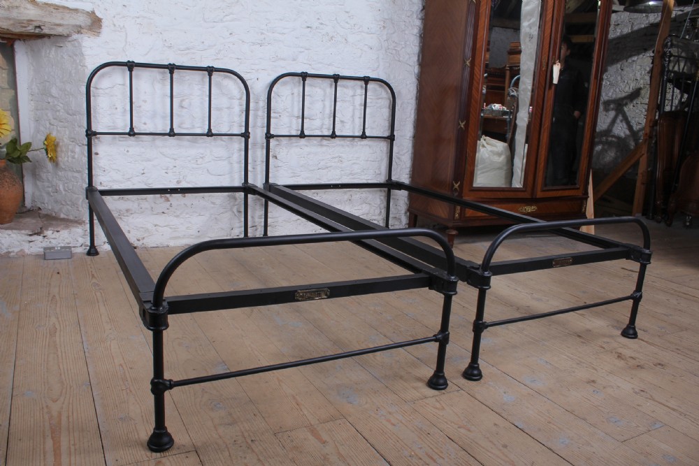 Lovely simple pair of Staples  utilitarian single iron beds (can be joined) View VI