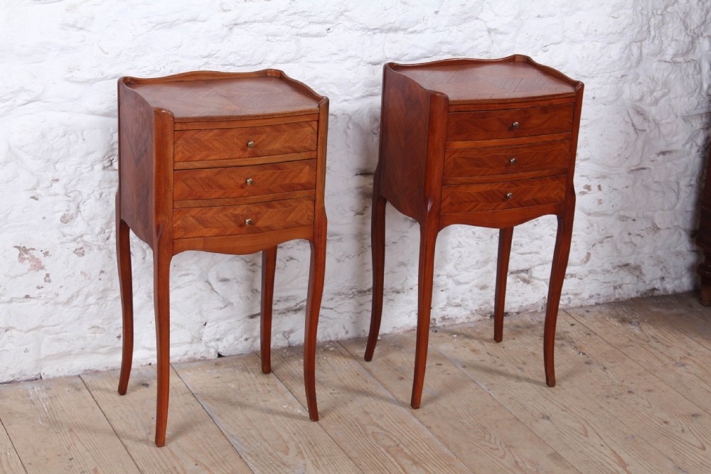 Pretty pair of walnut three drawer bedsides