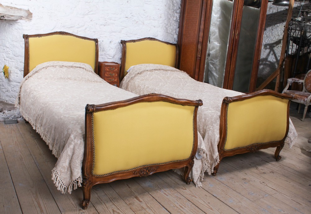 Yellow gold newly upholstered pair  French single beds