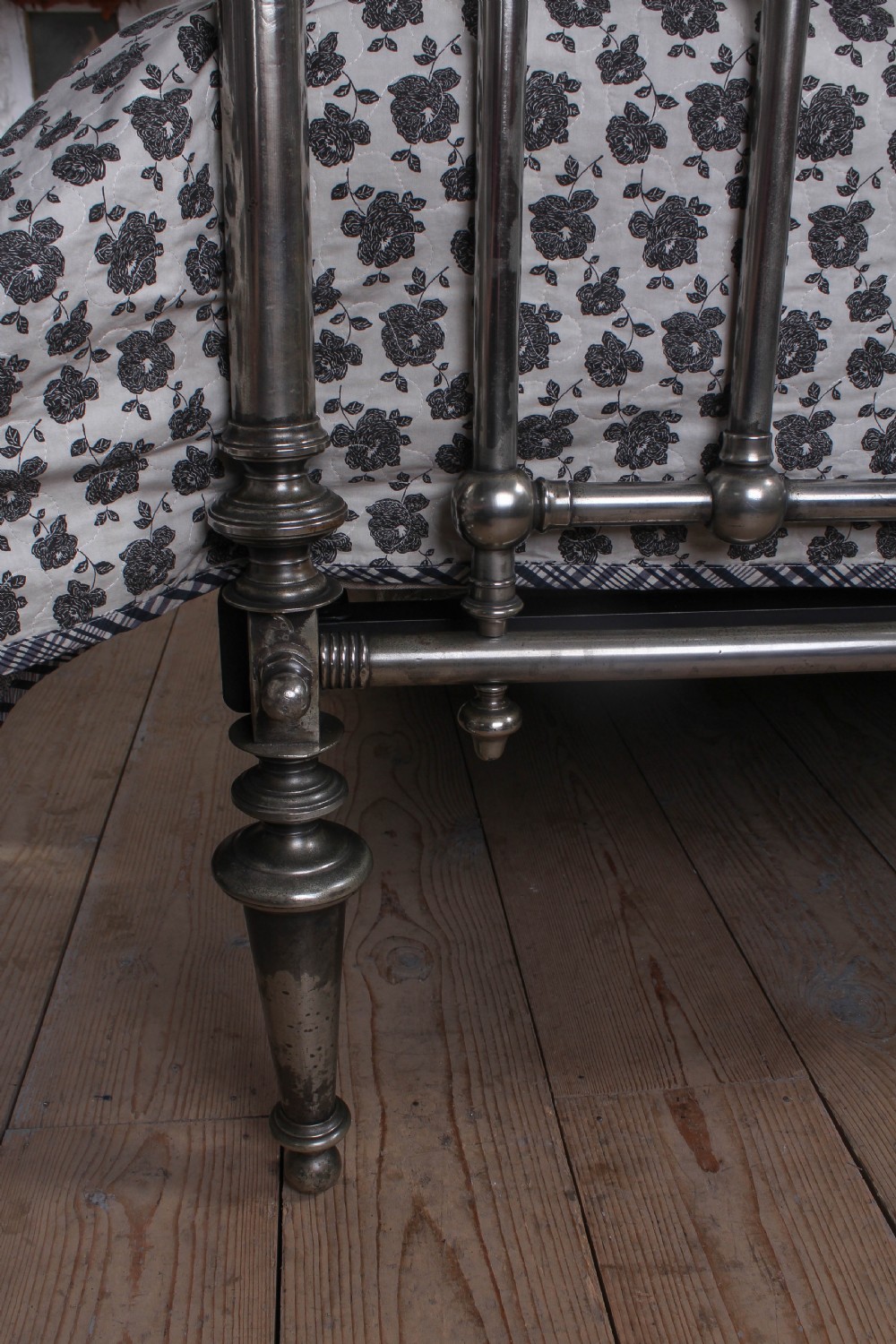 A nickel-plated super king size bedstead featuring Art Nouveau floral metalwork detailing on the arched headboard and footboard. View XIII