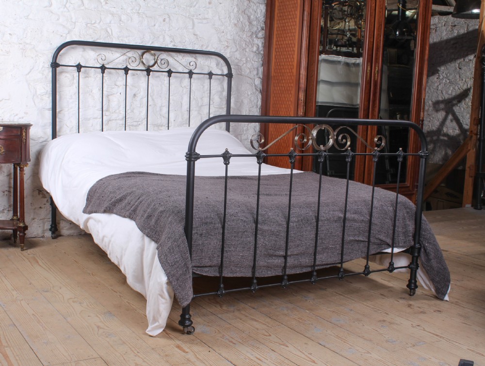 Alluring French black and brass double bed