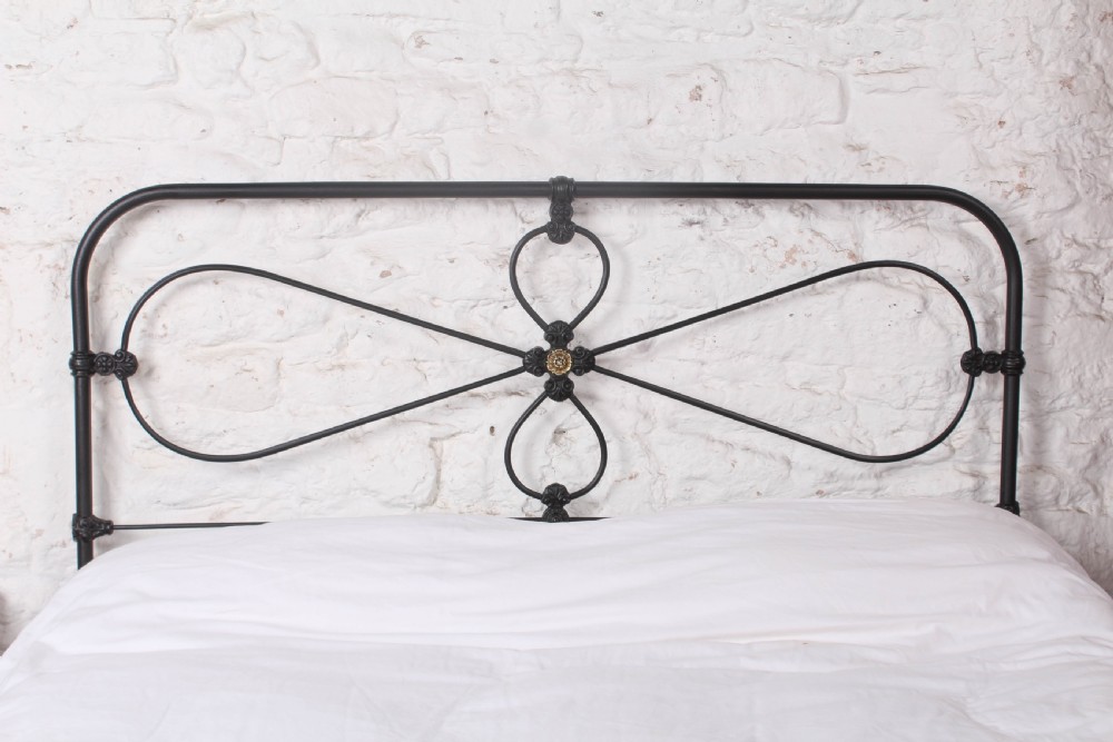 Lovely Irish Kingsize Bed with Central Brass Detail.  View II