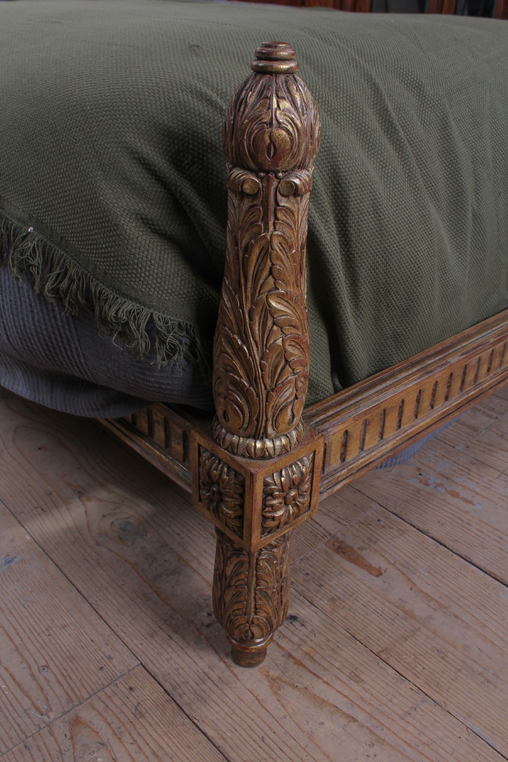 A French Neoclassical king-size bed featuring a carved giltwood frame with an arched caned headboard and detailed fluted posts. View II
