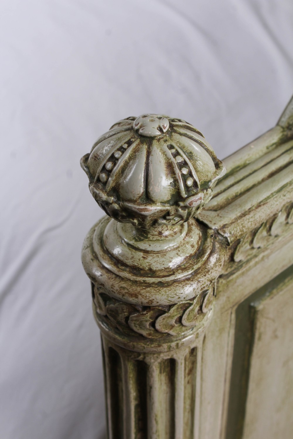 A French Louis XVI style king size bedstead in distressed sage green paint with carved fluted posts and decorative molding. View VI