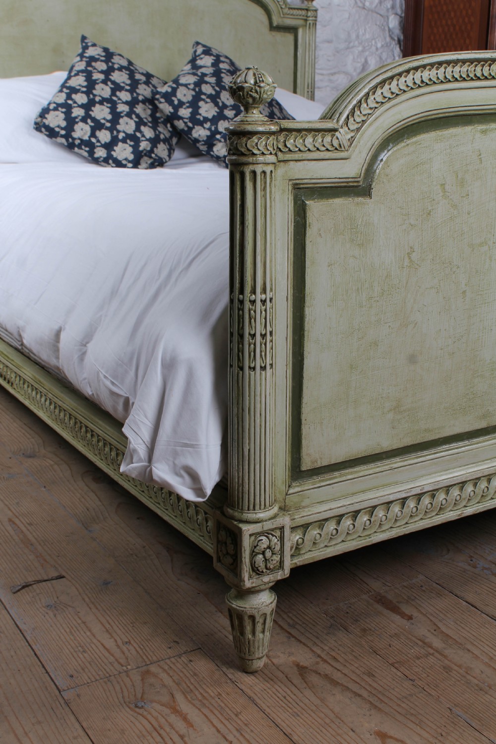 A French Louis XVI style king size bedstead in distressed sage green paint with carved fluted posts and decorative molding. View VII