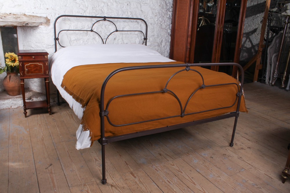 Pleasingly simple all iron Irish king size bed