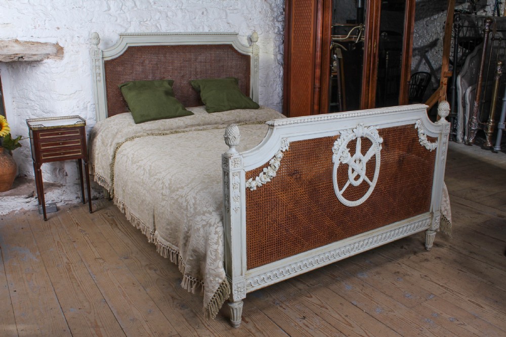Fabulous French carved and caned king size bed