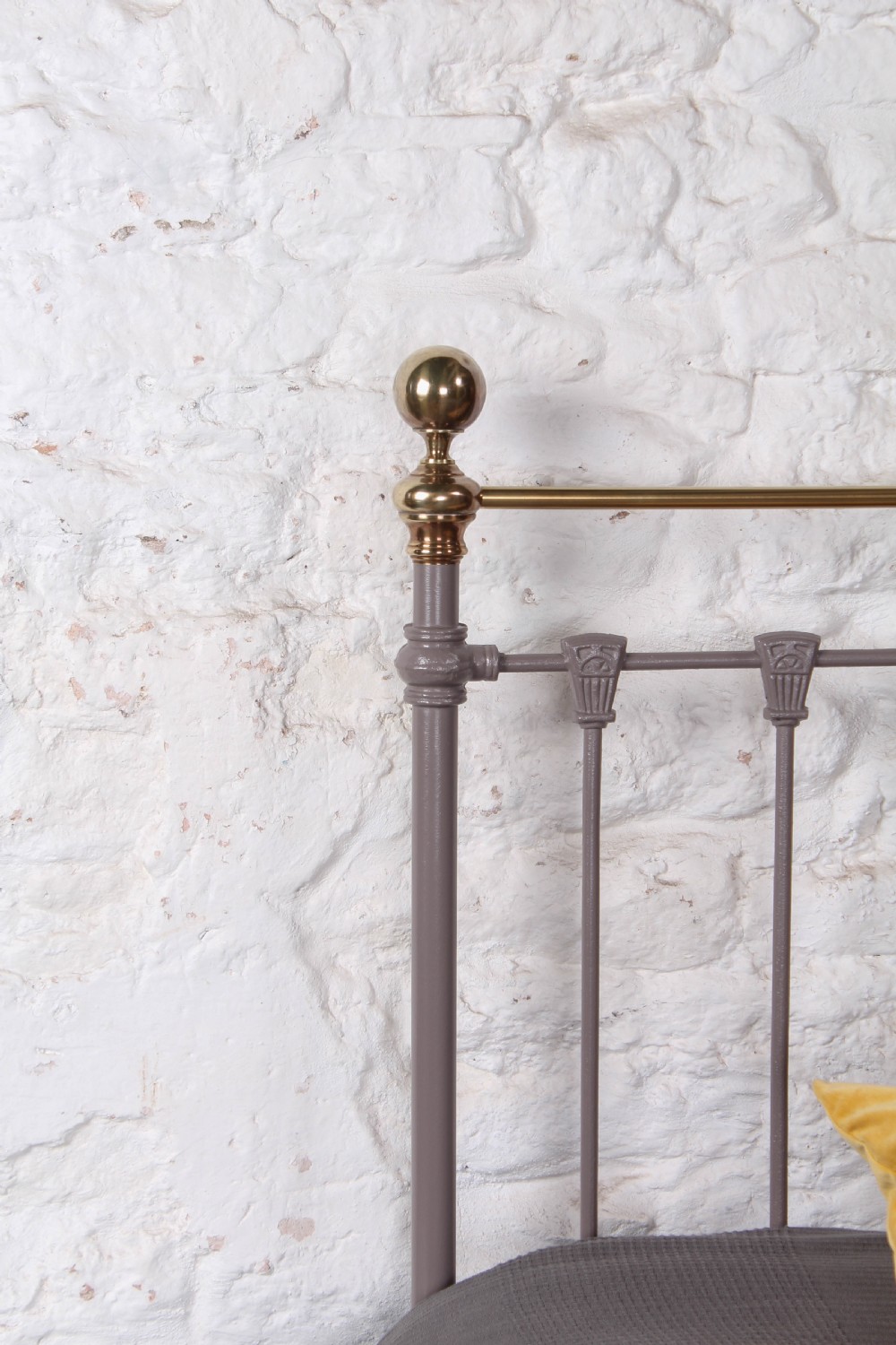 A Victorian double bed frame featuring a grey painted cast iron headboard with vertical spindles, a polished brass top rail, corner finials, and no footboard. View III