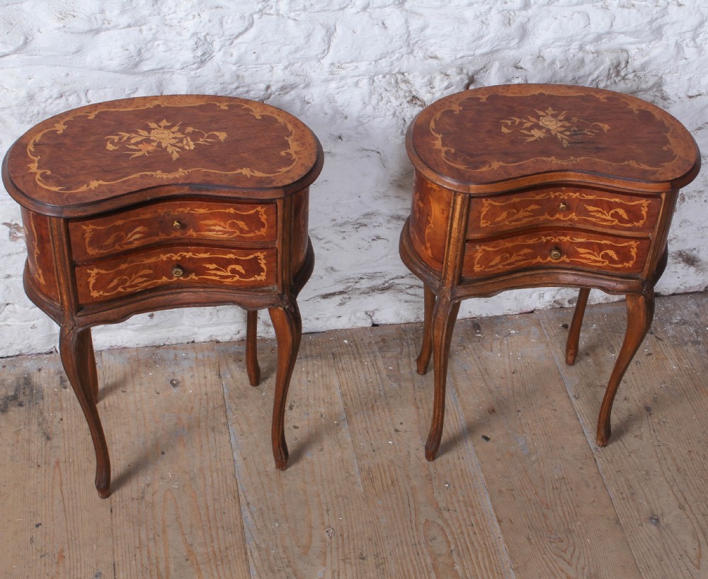 A pair of Louis XV style kidney-shaped bedside tables featuring floral marquetry inlays, two drawers, and slender cabriole legs. View II