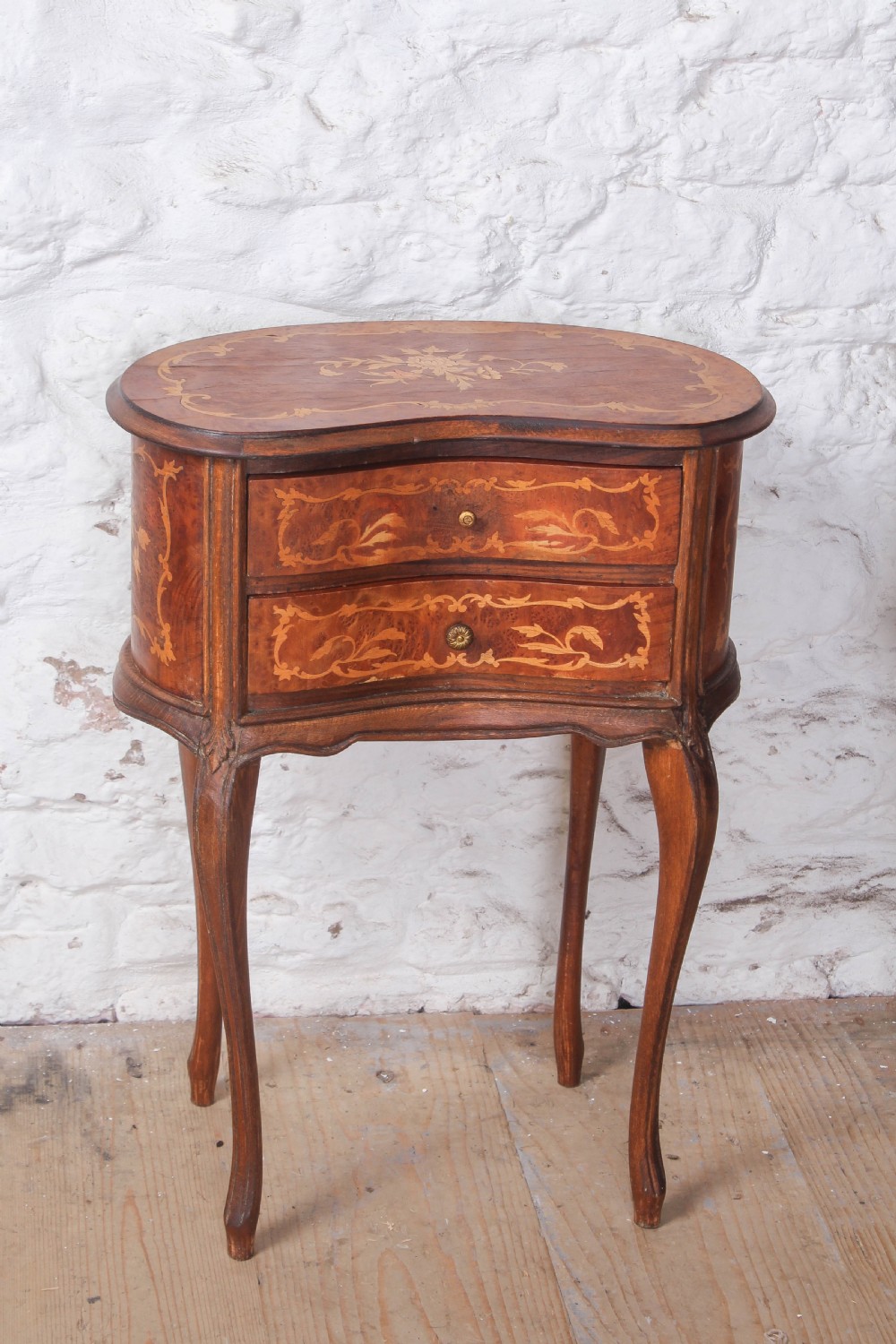A pair of Louis XV style kidney-shaped bedside tables featuring floral marquetry inlays, two drawers, and slender cabriole legs. View VII