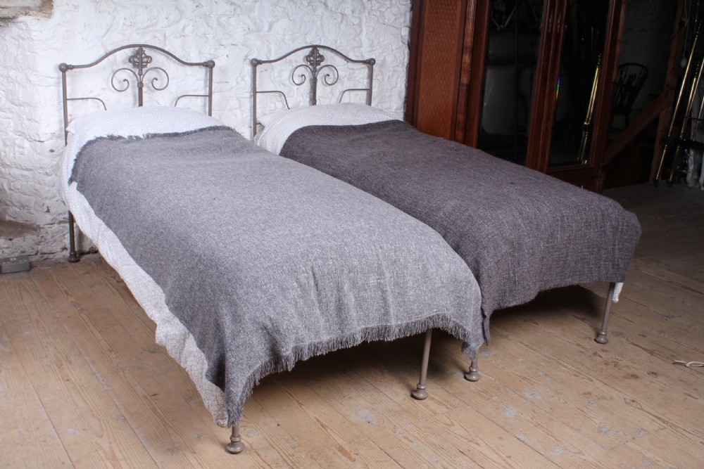 Petty pair of small single forged iron beds (can be joined)