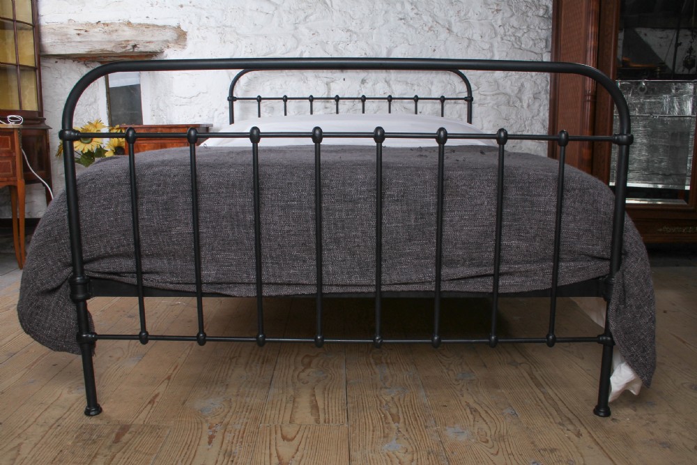 A black painted iron double bed frame featuring a vertical spindle headboard and matching footboard. View II
