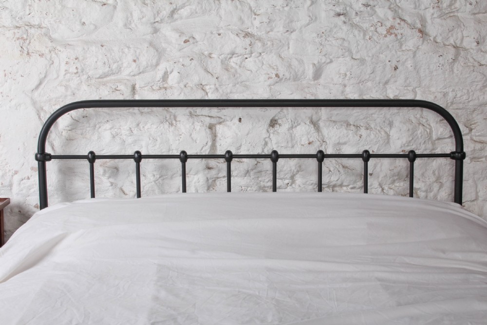 A black painted iron double bed frame featuring a vertical spindle headboard and matching footboard. View III