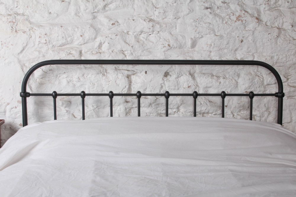 A black painted iron double bed frame featuring a vertical spindle headboard and matching footboard. View IV