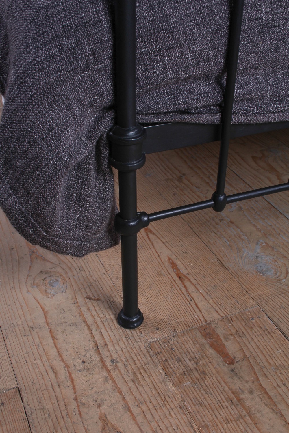 A black painted iron double bed frame featuring a vertical spindle headboard and matching footboard. View VI