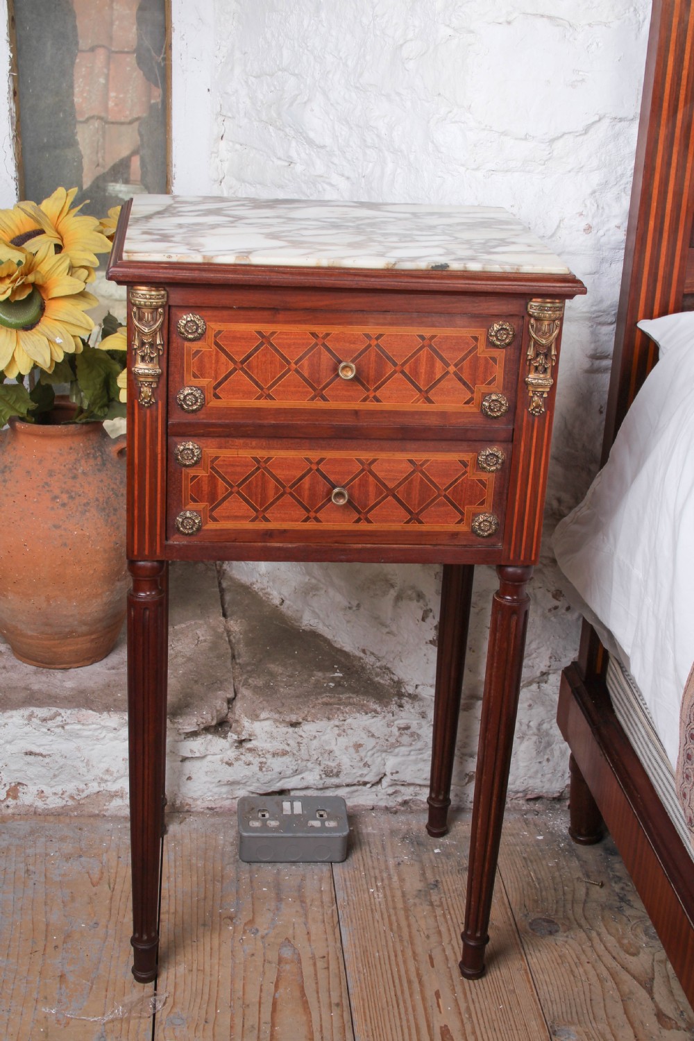 A French Empire style king size bed frame crafted from mahogany with diamond geometric fruitwood parquetry inlays and decorative brass mounts. View VI