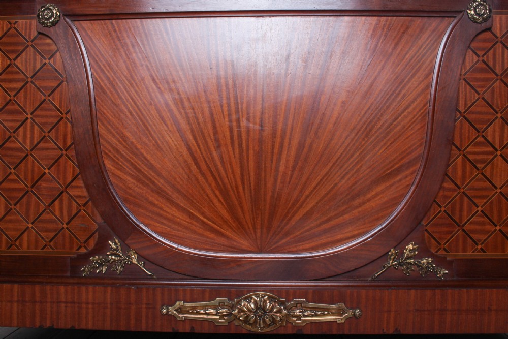 A French Empire style king size bed frame crafted from mahogany with diamond geometric fruitwood parquetry inlays and decorative brass mounts. View VIII