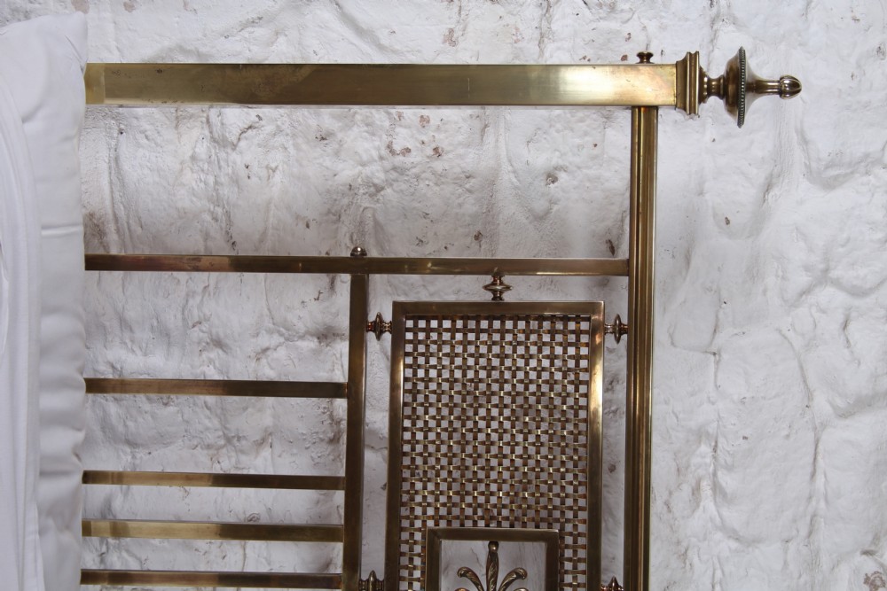 An antique French brass double bed frame with ornamental lattice headboard and footboard panels, vertical spindles, and finial corner posts. View XII