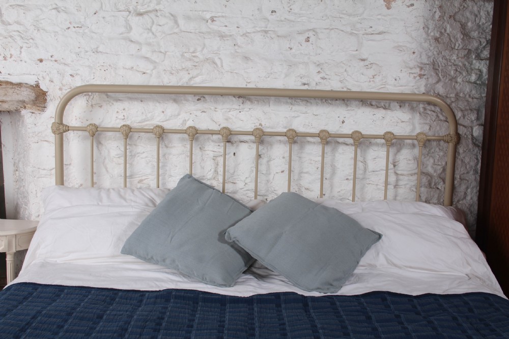 A cream-painted French iron super king size bed frame featuring vertical spindles and cast iron ornamental details. View III
