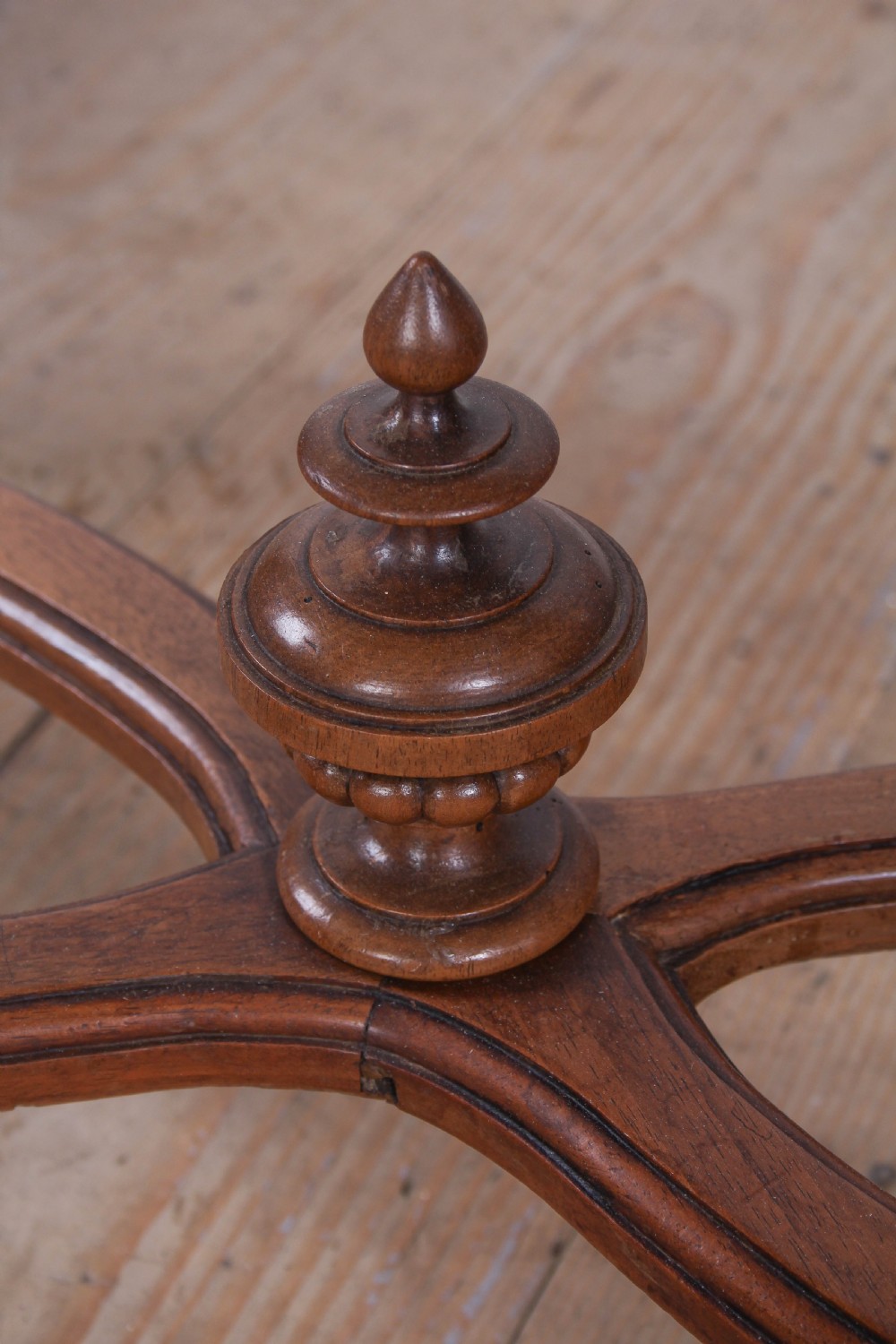 A Louis XVI style fruitwood table featuring a single frieze drawer with brass handle, turned fluted legs, and an X-frame stretcher with a central finial. View IV
