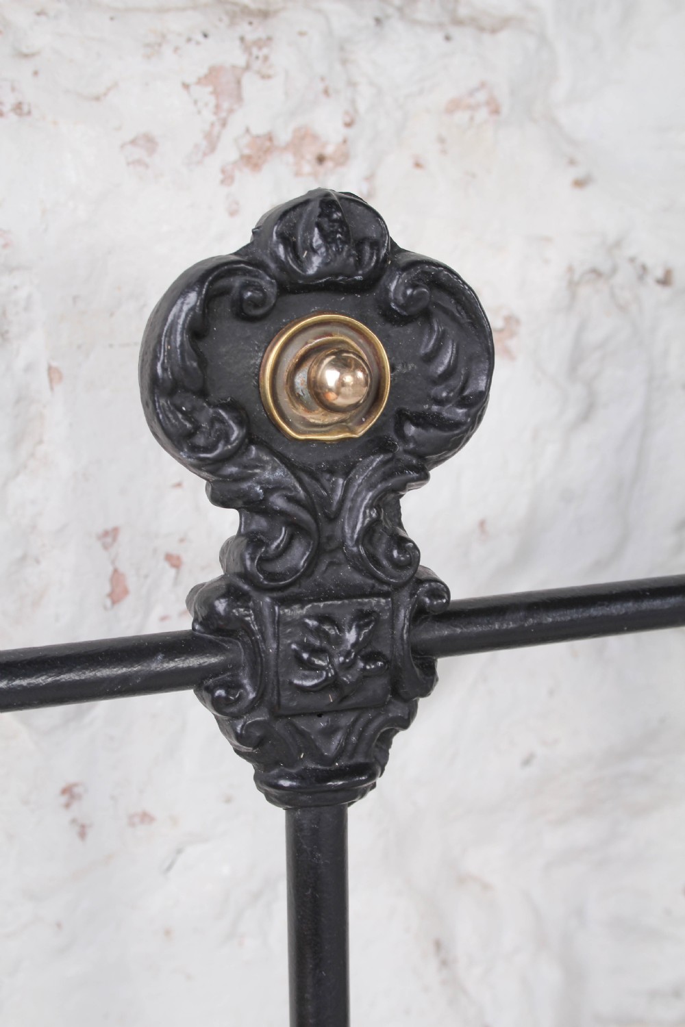 A pair of black wrought iron French single bed frames featuring vertical spindles with cast decorative rosettes and no footboards. View VII
