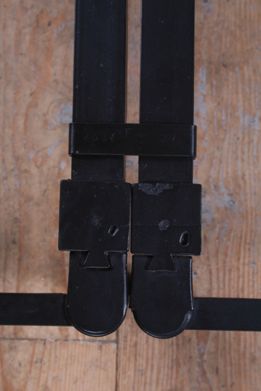 A pair of black wrought iron French single bed frames featuring vertical spindles with cast decorative rosettes and no footboards. View VIII