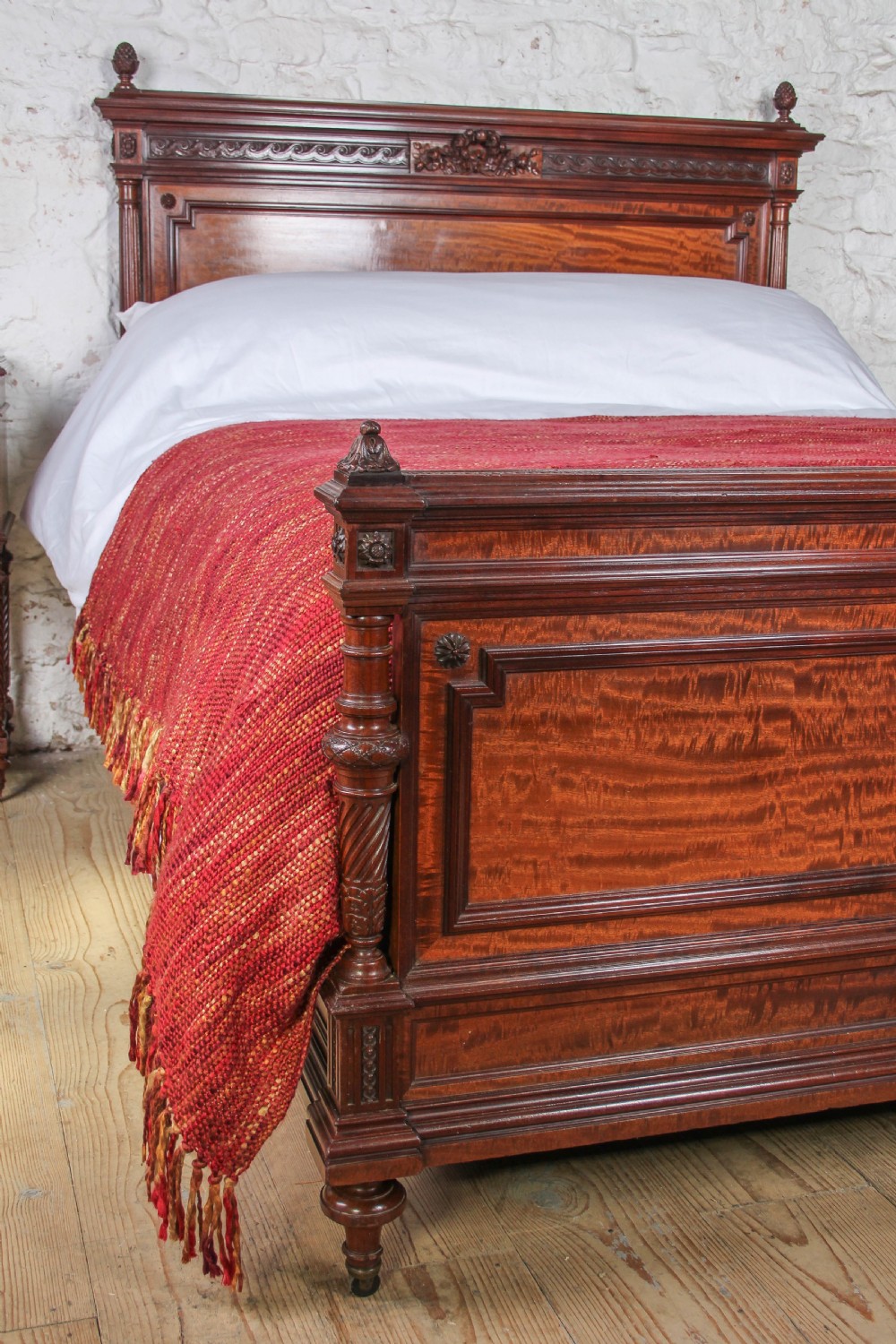 A French Louis XVI style carved mahogany king size bedstead with flame mahogany panelled footboard. View VIII