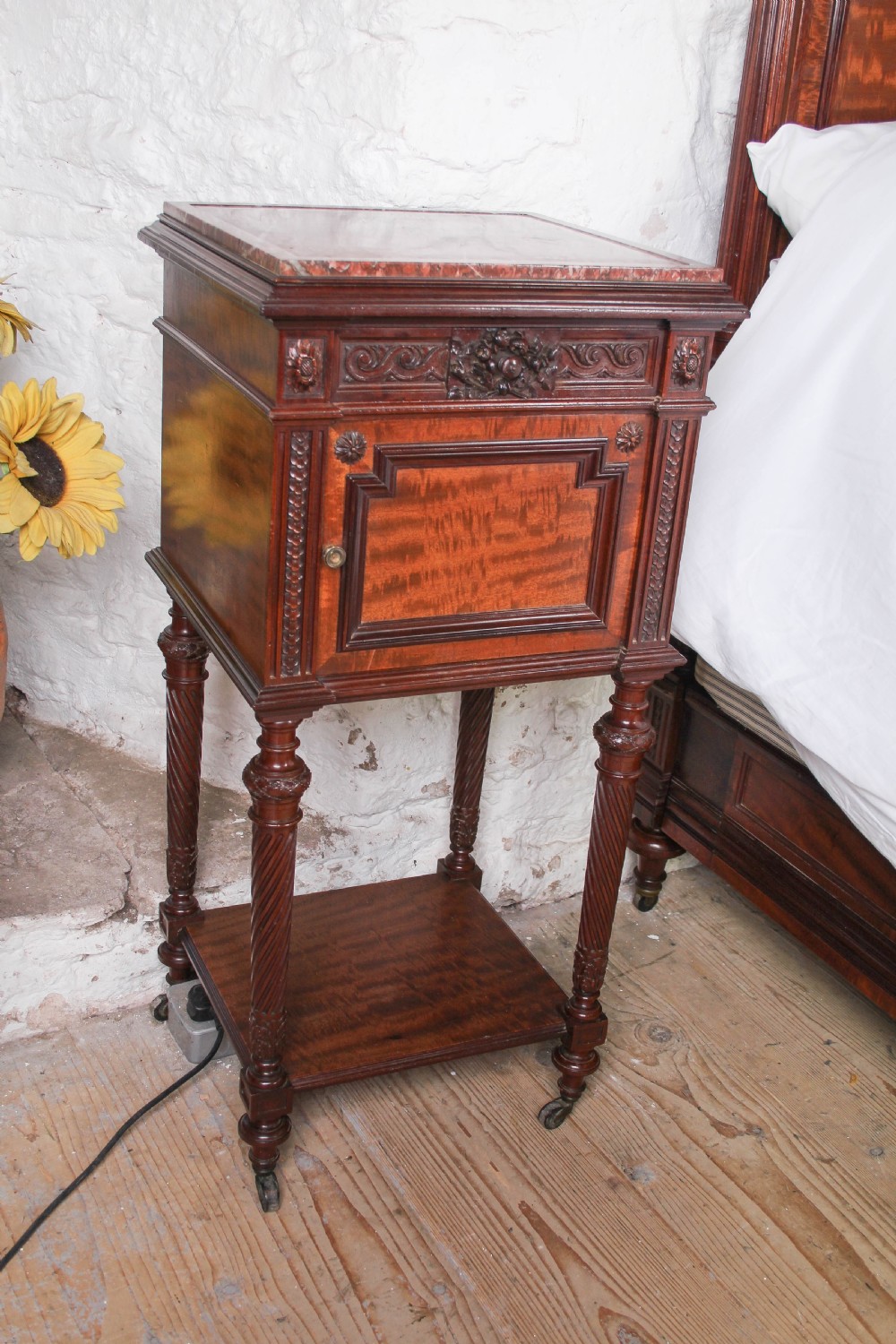 A French Louis XVI style carved mahogany king size bedstead with flame mahogany panelled footboard. View XI