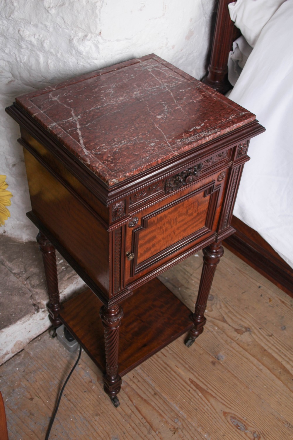 A French Louis XVI style carved mahogany king size bedstead with flame mahogany panelled footboard. View XII