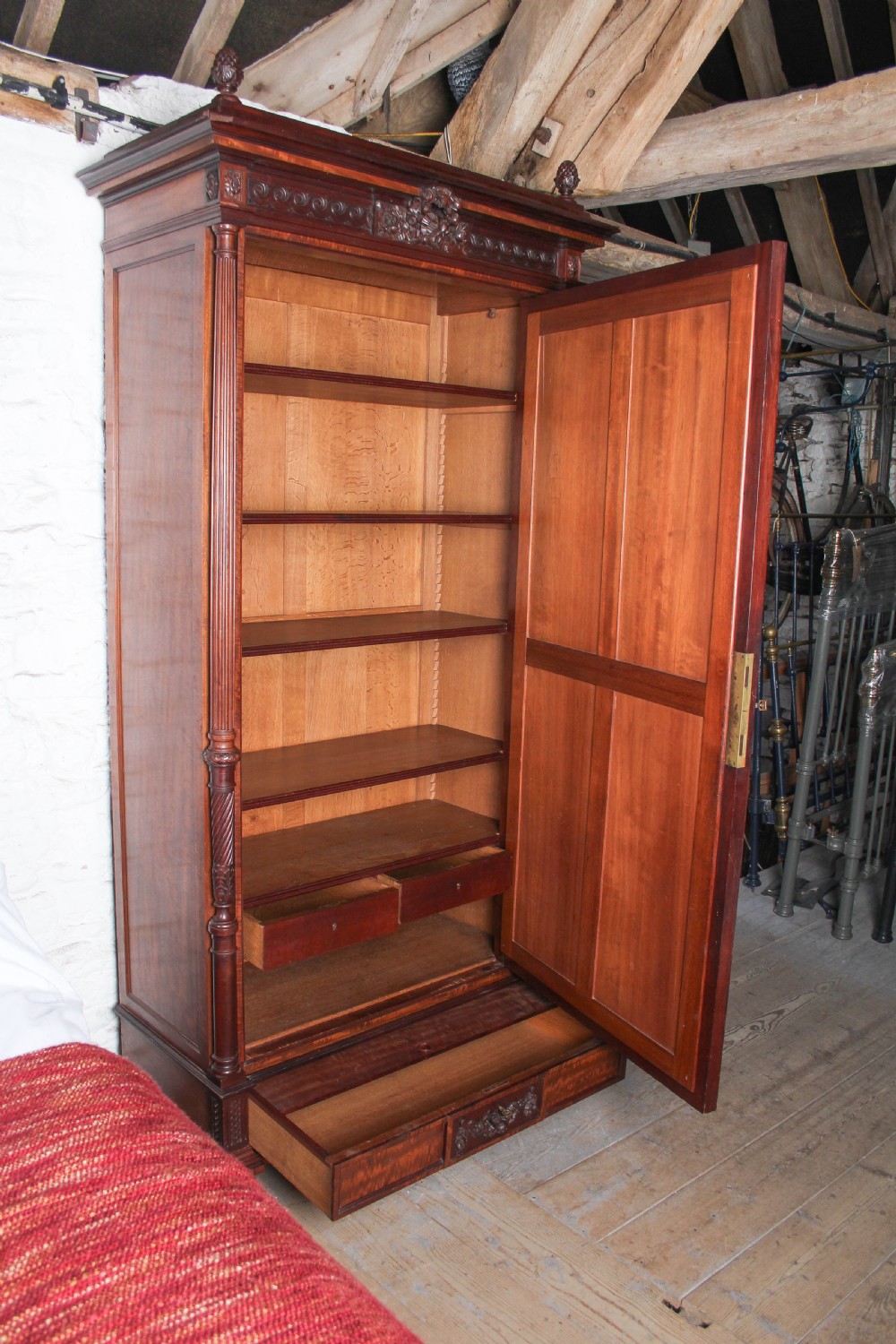 A French Louis XVI style carved mahogany king size bedstead with flame mahogany panelled footboard. View XV