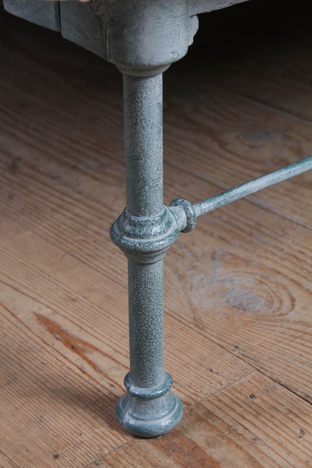 A Victorian king-size light blue painted iron bedstead featuring a straight brass top rail with polished brass corner finials. View VII