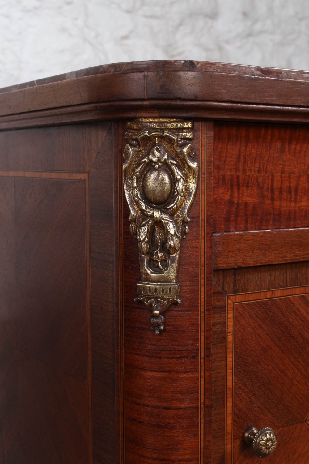 A pair of tall French fruitwood bedside tables featuring square marble tops, diamond parquetry cupboard doors, single drawers, and slender turned tapered legs. View VIII