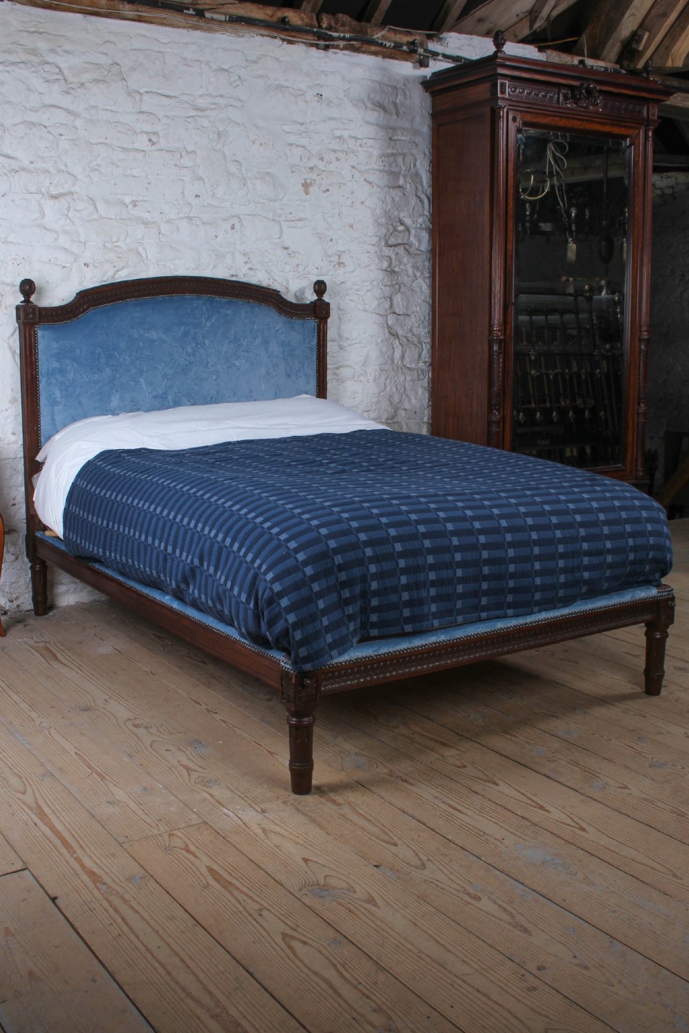 A Louis XVI style oak double bed frame featuring an arched headboard and low footboard upholstered in light blue fabric with trim details. View VIII