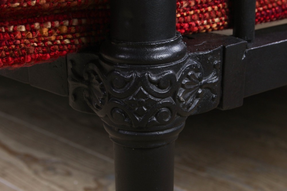 A Victorian black iron and brass king-size bedstead featuring vertical spindles, decorative brass mounts, and brass ball finials. View VII